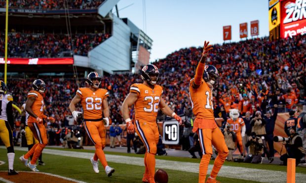 DENVER, CO - NOVEMBER 25:  Wide receiver Emmanuel Sanders #10 of the Denver Broncos celebrates afte...