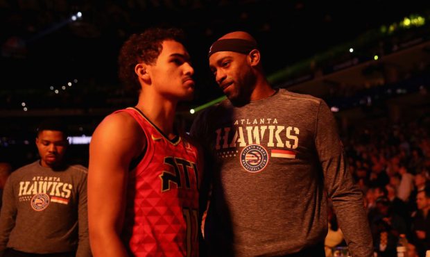 OAKLAND, CA - NOVEMBER 13:  Trae Young #11 talks to Vince Carter #15 of the Atlanta Hawks before th...