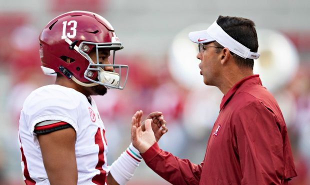 FAYETTEVILLE, AR - OCTOBER 6:  Tua Tagovailoa #13 talks with Associate Head Coach Dan Enos of the A...