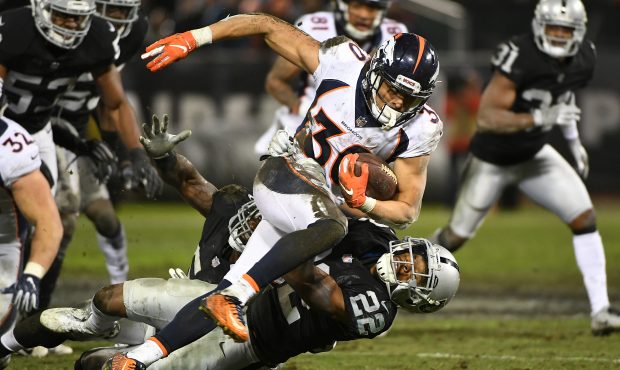 Phillip Lindsay #30 of the Denver Broncos rushes with the ball against the Oakland Raiders during t...
