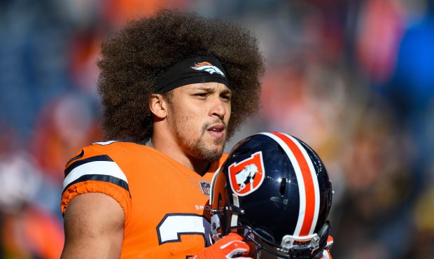 Running back Phillip Lindsay #30 of the Denver Broncos stands on the field during player warm ups b...