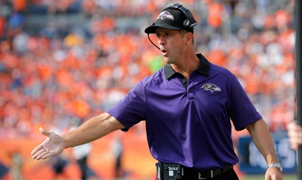 Head coach John Harbaugh of the Baltimore Ravens leads his team against the Denver Broncos at Sport...