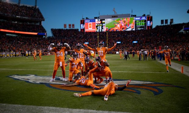 DENVER, CO - NOVEMBER 25:  Denver Broncos defensive players celebrate in the end zone after a fumbl...