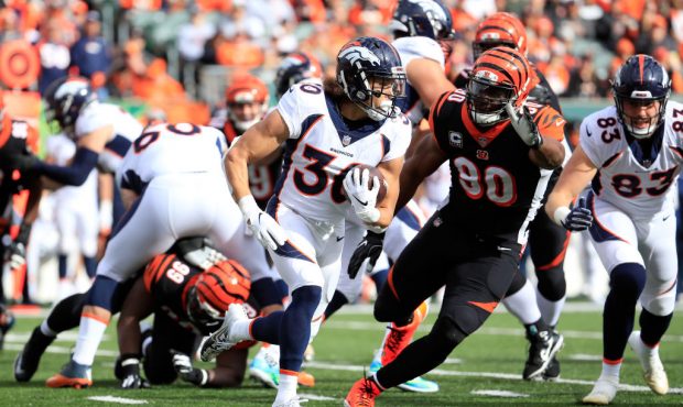 CINCINNATI, OH - DECEMBER 02:  Phillip Lindsay #30 of the Denver Broncos attempts to run the ball p...
