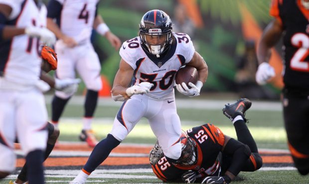 CINCINNATI, OH - DECEMBER 2:  Phillip Lindsay #30 of the Denver Broncos slips out of an attempted t...