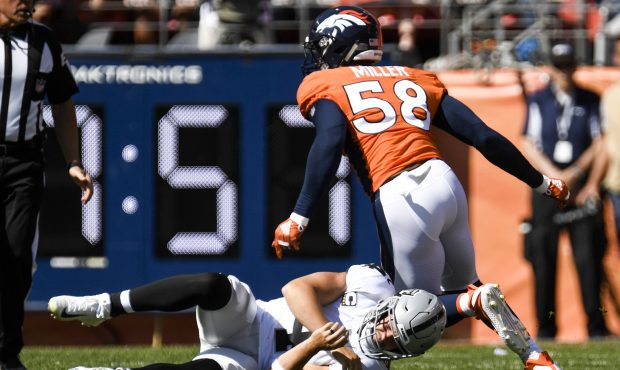Von Miller (58) of the Denver Broncos celebrates after sacking Derek Carr (4) of the Oakland Raider...