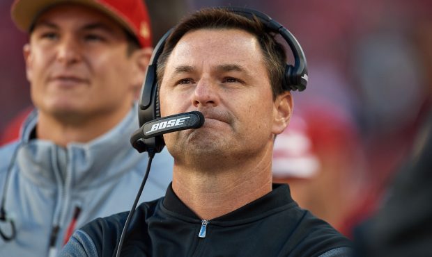 San Francisco 49ers Quarterbacks coach Rich Scangarello talks into his headset during an NFL game b...