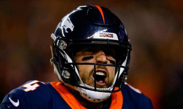 DENVER, CO - DECEMBER 15:  Quarterback Case Keenum #4 of the Denver Broncos celebrates after a firs...