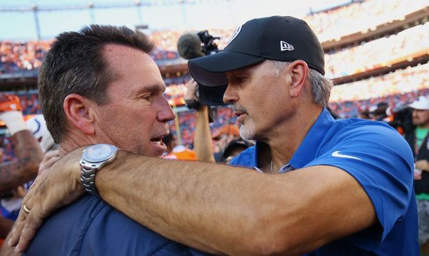 DENVER, CO - SEPTEMBER 18:  Head coach Gary Kubiak of the Denver Broncos shakes hands with head coa...