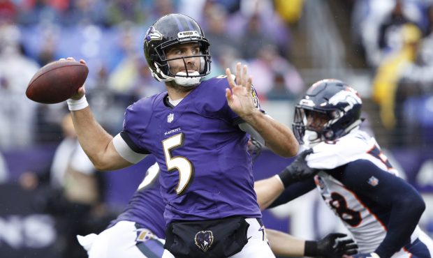 Joe Flacco #5 of the Baltimore Ravens throws a pass in the second quarter of the game against the D...