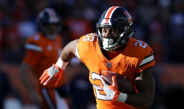 Royce Freeman #28 of the Denver Broncos carries the ball against the Pittsburgh Steelers at Broncos...