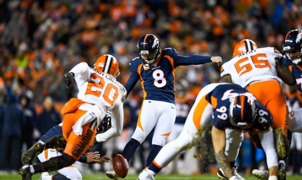 Kicker Brandon McManus #8 of the Denver Broncos kicks a fourth quarter field goal against the Cleve...
