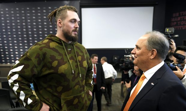 Derek Wolfe meets his new head coach, Vic Fangio, after he was introduced as the 17th head coach in...