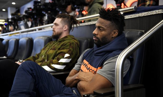 Broncos #95 Derek Wolfe and #10 Emmanuel Sanders listen as Head Coach Vic Fangio makes his remarks ...