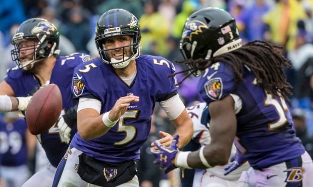 BALTIMORE, MD - SEPTEMBER 23: Joe Flacco #5 of the Baltimore Ravens pitches to Alex Collins #34 as ...