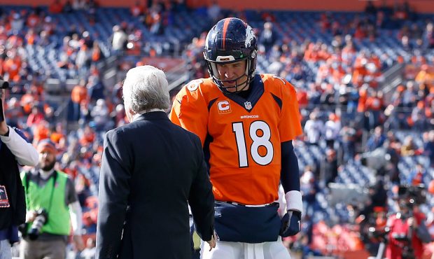 DENVER, CO - JANUARY 24:  New England Patriots owner Robert Kraft speaks to  Peyton Manning #18 of ...