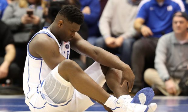DURHAM, NORTH CAROLINA - FEBRUARY 20: Zion Williamson #1 of the Duke Blue Devils reacts after falli...