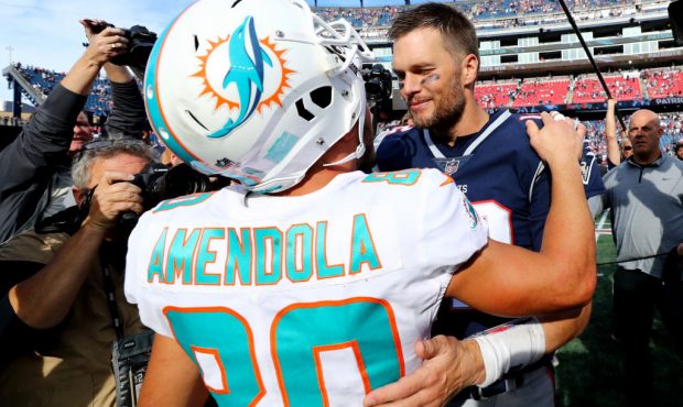 FOXBOROUGH, MA - SEPTEMBER 30: Danny Amendola #80 of the Miami Dolphins and Tom Brady #12 of the Ne...