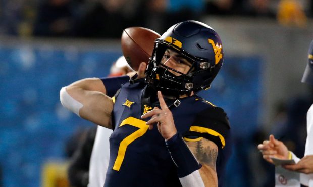 MORGANTOWN, WV - NOVEMBER 23:  Will Grier #7 of the West Virginia Mountaineers warms up before the ...