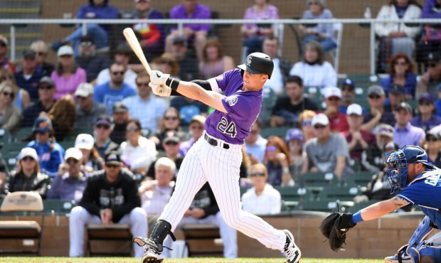 SCOTTSDALE, AZ - MARCH 15:  Ryan McMahon #24 of the Colorado Rockies follows through on a swing aga...