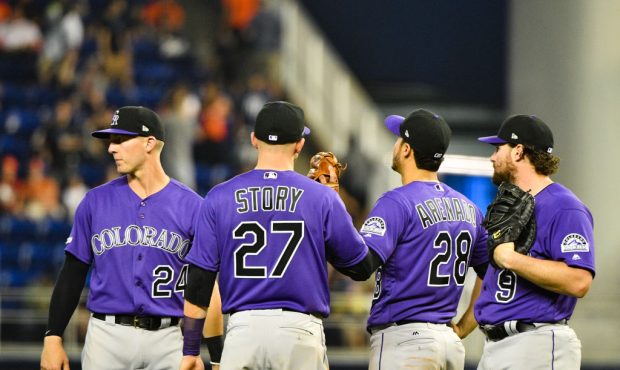 MIAMI, FL - MARCH 28: Trevor Story #27, Ryan McMahon #24, Nolan Arenado #28, and Daniel Murphy #9 o...