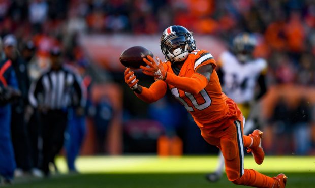 DENVER, CO - NOVEMBER 25:  Wide receiver Emmanuel Sanders #10 of the Denver Broncos dives for a bal...