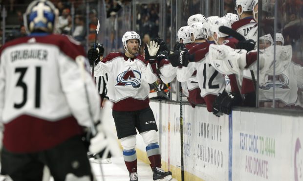 ANAHEIM, CALIFORNIA - MARCH 03:  Derick Brassard #18 of the Colorado Avalanche high-fives teammates...