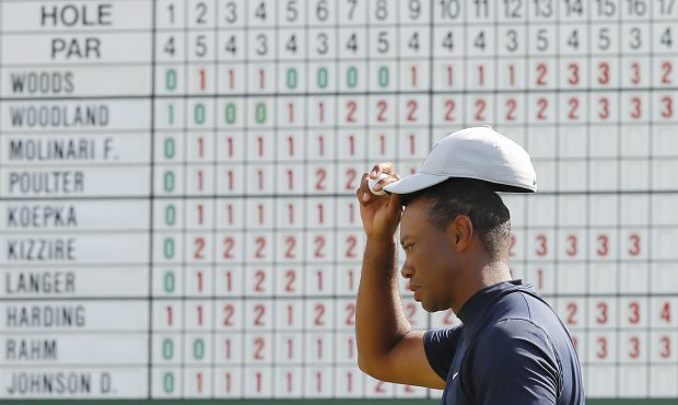 Tiger Woods of the United States reacts on the 18th green during the first round of the Masters at ...