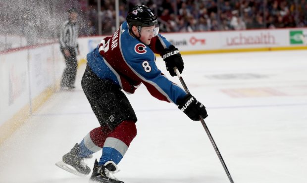 DENVER, COLORADO - APRIL 15: Cale Makar #8 of the Colorado Avalanche passes the puck while playing ...