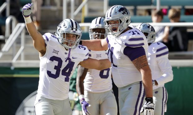 WACO, TX - NOVEMBER 19:  Alex Barnes #34 of the Kansas State Wildcats celebrates his touchdown with...