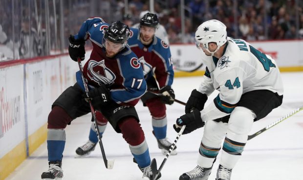 DENVER, COLORADO - MAY 06: Tyson Jost #17 of the Colorado Avalanche advances the puck against Marc-...