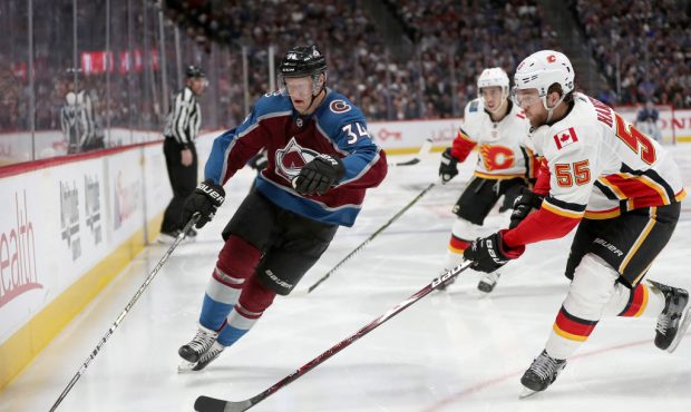 DENVER, COLORADO - APRIL 17:  Carl Soderberg #34 of the Colorado Avalanche advances the puck agains...