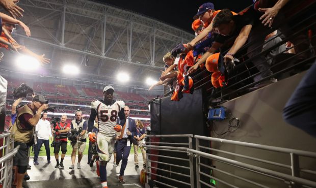 GLENDALE, AZ - OCTOBER 18:  Linebacker Von Miller #58 of the Denver Broncos runs past fans as he le...