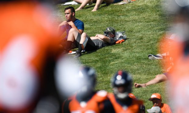 A young fan snoozes during Denver Broncos training camp on Thursday, July 18, 2019. (Photo by AAron...