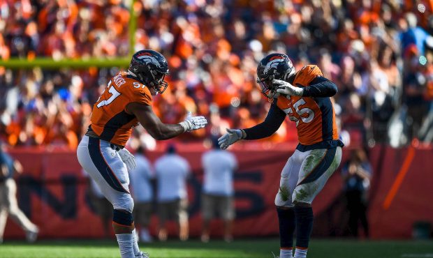 DENVER, CO - SEPTEMBER 29: Bradley Chubb #55 and DeMarcus Walker #57 of the Denver Broncos celebrat...