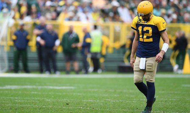 GREEN BAY, WISCONSIN - SEPTEMBER 22: Aaron Rodgers #12 of the Green Bay Packers walks to the huddle...
