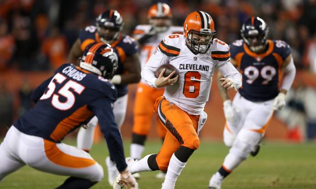 DENVER, COLORADO - DECEMBER 15: Quarterback Baker Mayfield #4 of the Cleveland Browns carries the b...
