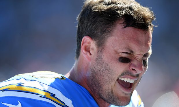 Philip Rivers #17 of the Los Angeles Chargers talks on the sidelines during the first quarter again...