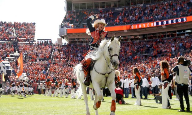 DENVER, COLORADO - OCTOBER 13:  The Denver Broncos take the field against the Tennessee Titans at B...