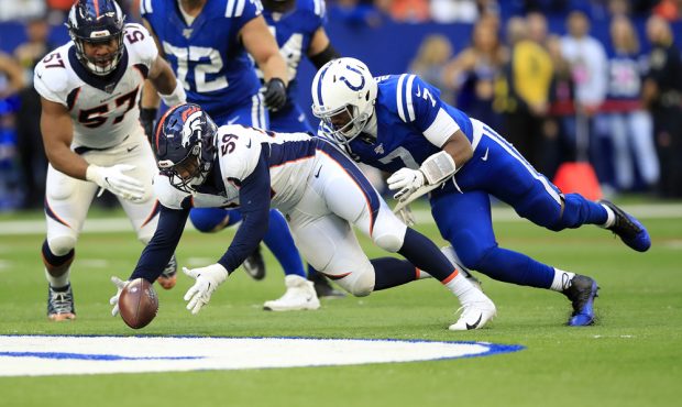 INDIANAPOLIS, INDIANA - OCTOBER 27: Malik Reed #59 of the Denver Broncos reaches to recover a fumbl...