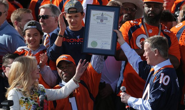 (L-R) Annabel Bowlen, wife of Pat Bowlen owner and CEO of the Denver Broncos, is presented a procla...