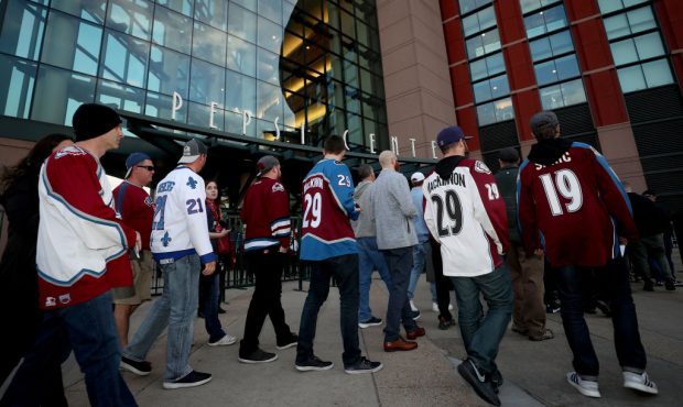 Fans enter the Pepsi Center to watch the Colorado Avalanche play the San Jose Sharks during Game Fo...
