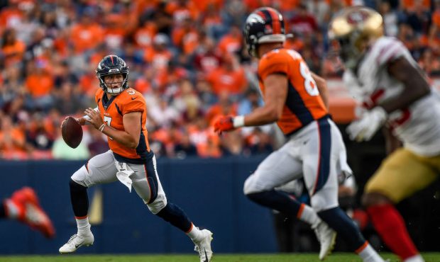 DENVER, CO - AUGUST 19:  Quarterback Drew Lock #3 of the Denver Broncos rolls out of the pocket aga...