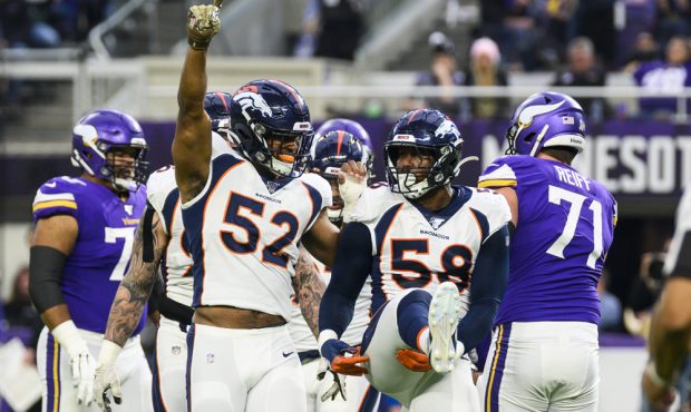 MINNEAPOLIS, MN - NOVEMBER 17: Von Miller #58 of the Denver Broncos celebrates with Justin Hollins ...