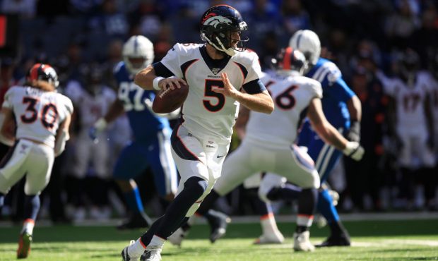 INDIANAPOLIS, INDIANA - OCTOBER 27:  Joe Flacco #5 of the Denver Broncos looks to pass the ball aga...