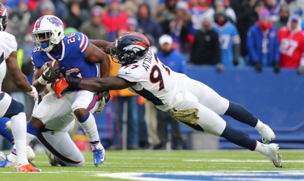 ORCHARD PARK, NY - NOVEMBER 24: Jeremiah Attaochu #97 of the Denver Broncos dives to try and tackle...
