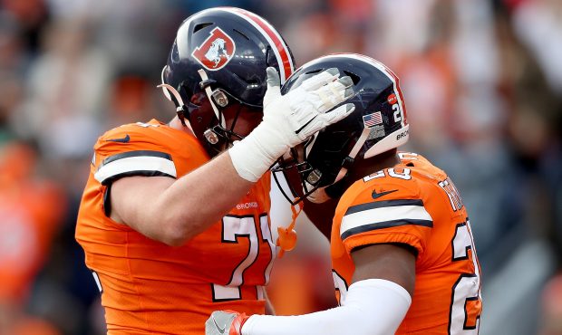 DENVER, COLORADO - DECEMBER 22: Royce Freeman #28 of the Denver Broncos is congratulated by Garett ...