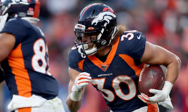 DENVER, COLORADO - DECEMBER 01: Phillip Lindsay #30 of the Denver Broncos carries the ball against ...