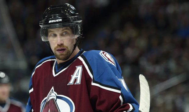 DENVER - MARCH 23: Peter Forsberg #21 of the Colorado Avalanche waits for the puck to drop on a fac...