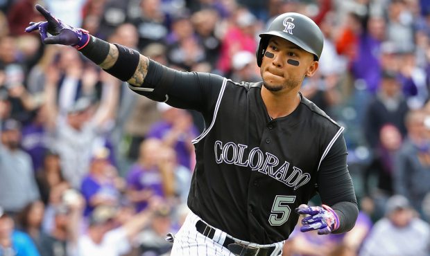 DENVER, CO - APRIL 10: Carlos Gonzalez #5 of the Colorado Rockies celebrates his solo home run off ...